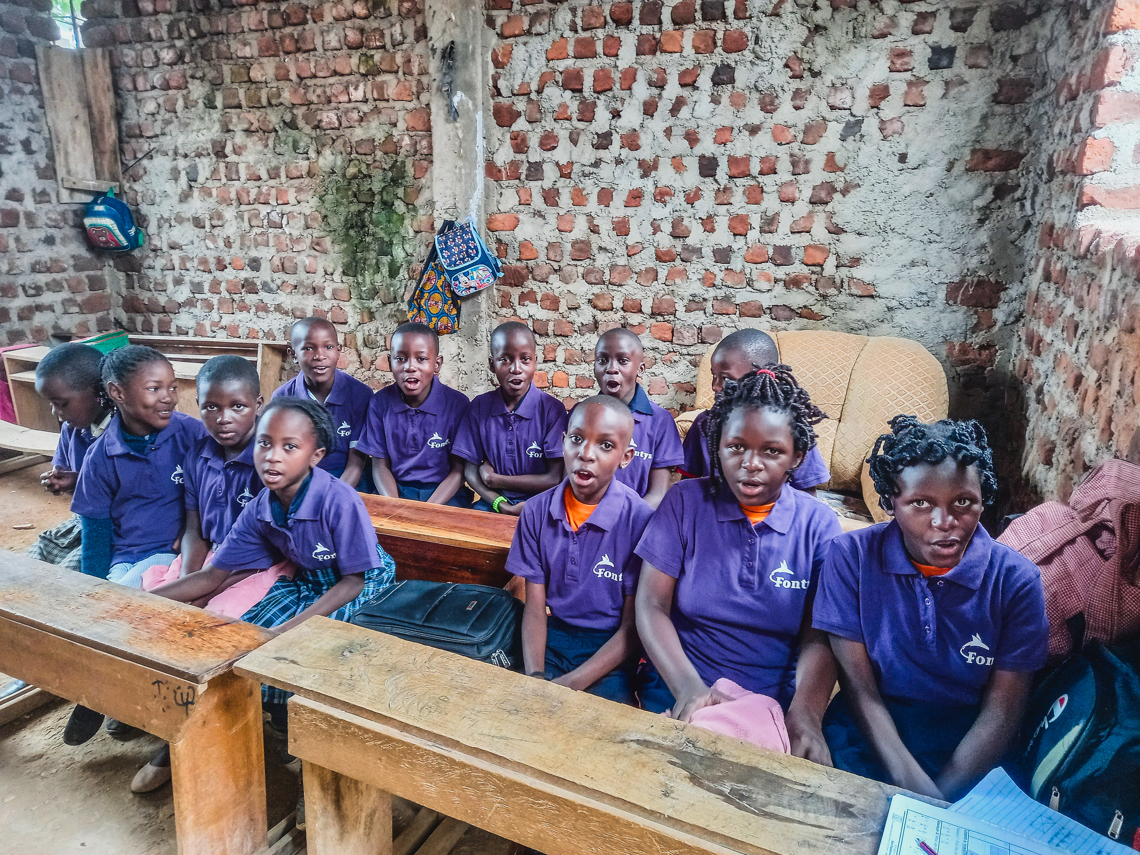 Group of children looking out a window